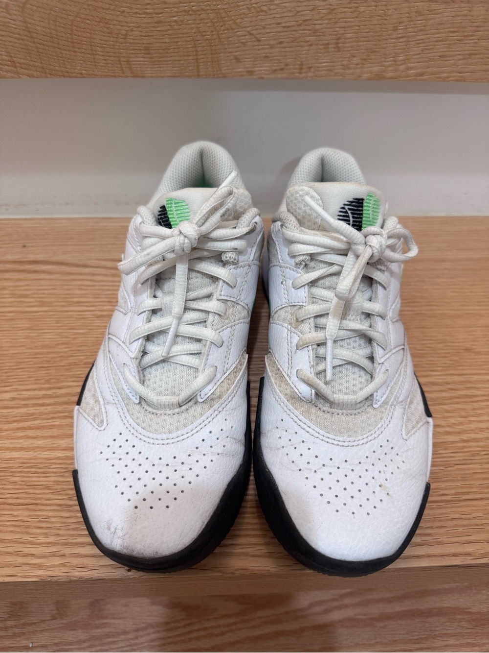 Nike White Low-Top Sneakers with Black Sole and Green Tongue Detail